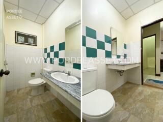 Modern bathroom with checkered tile design and marble countertop