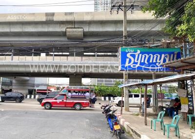 Street view of the property with public transportation and surrounding infrastructure