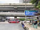 Street view of the property with public transportation and surrounding infrastructure