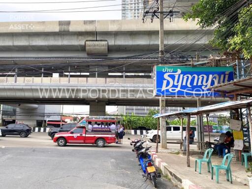 Street view of the property with public transportation and surrounding infrastructure