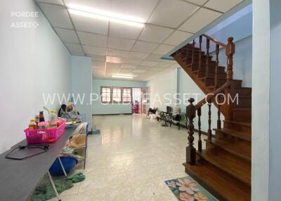 spacious living area with staircase