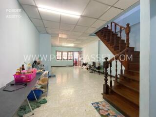 spacious living area with staircase