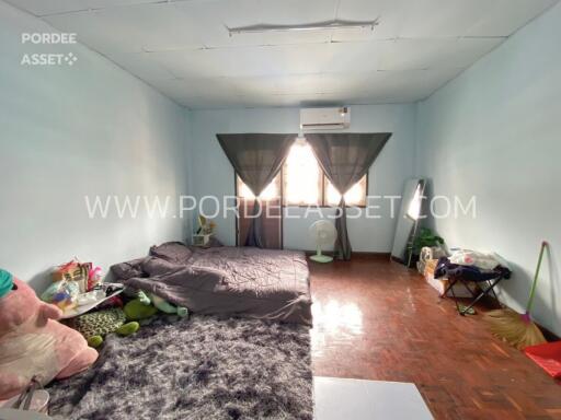 spacious bedroom with bed and window