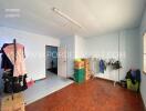 Bedroom with wooden flooring and open storage boxes