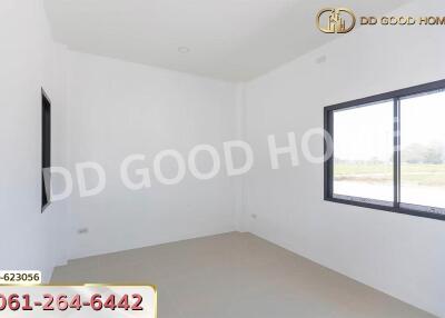 Empty room with large window and white walls