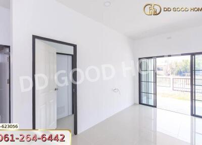 A bright bedroom with sliding doors leading to a balcony or patio