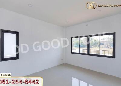 Living room with large windows and white walls