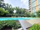 Outdoor pool area with seating in a residential building