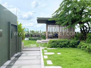 Modern garden with greenery and outdoor seating area