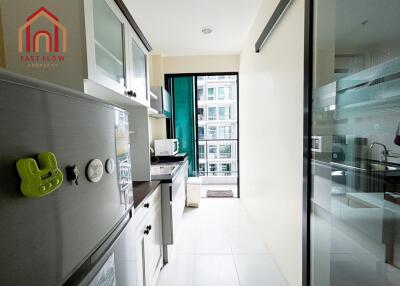 Modern kitchen with appliances and white cabinetry