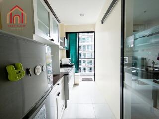 Modern kitchen with appliances and white cabinetry