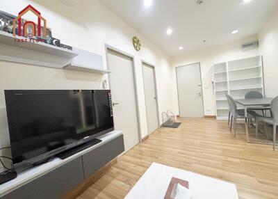 Modern living room with TV and dining area