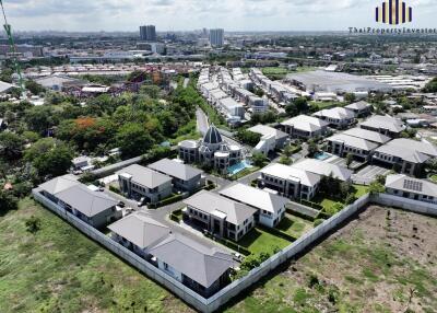 Aerial view of a residential neighborhood with multiple houses and buildings