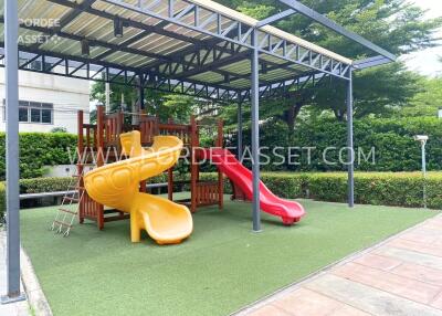 Outdoor playground with slides and climbing structure