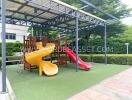 Outdoor playground with slides and climbing structure