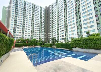 Modern apartment complex with communal swimming pool