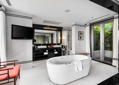 Modern bathroom with freestanding bathtub and large mirror