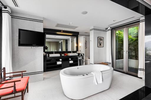 Modern bathroom with freestanding bathtub and large mirror