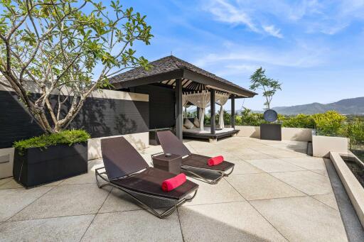 Outdoor patio with lounge chairs and gazebo