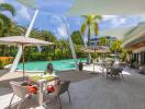 Outdoor pool area with seating and umbrellas