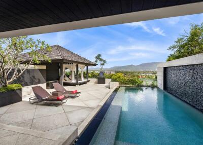 Luxurious outdoor area with pool and lounge