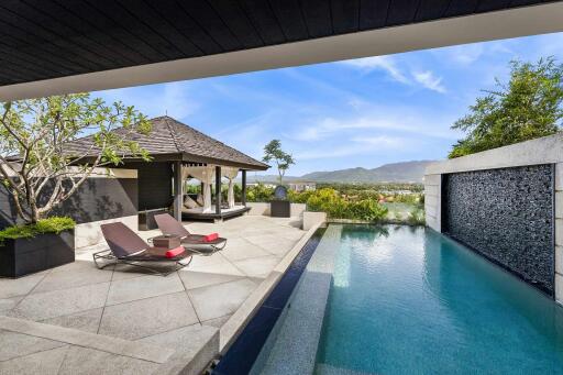 Luxurious outdoor area with pool and lounge