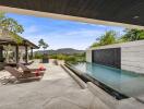 Luxurious outdoor area with pool and lounge chairs