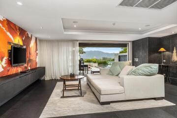 Modern living room with mountain view and patio access