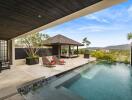 Luxurious outdoor area with pool and loungers