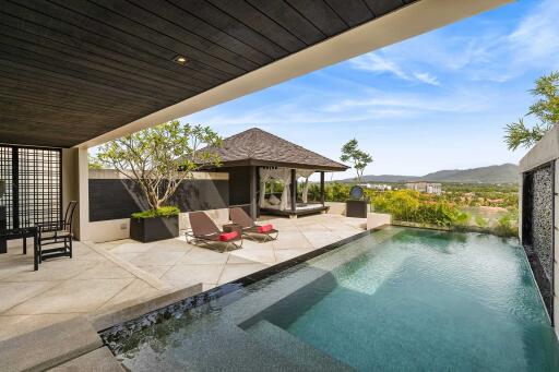 Luxurious outdoor area with pool and loungers