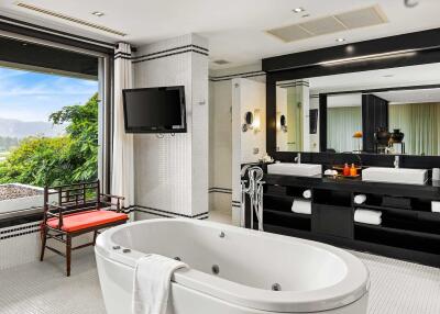 Spacious bathroom with large bathtub and dual sinks