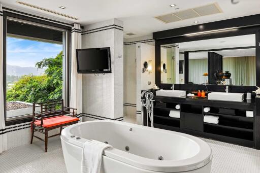 Spacious bathroom with large bathtub and dual sinks