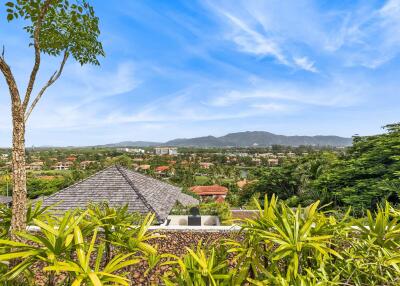 Scenic view overlooking a residential area with mountains in the background