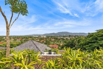 Scenic view overlooking a residential area with mountains in the background