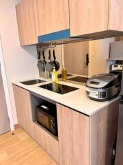 Modern kitchen with wooden cabinets and appliances