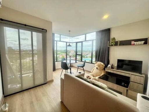 Bright and cozy living room with a scenic view from large windows