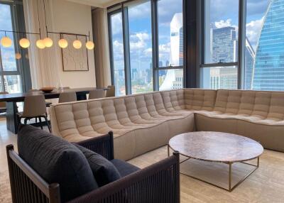 Modern living room with large windows and city view