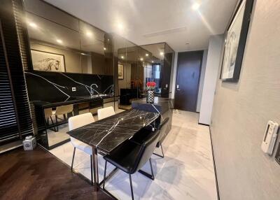 Modern dining area with black marble table and stylish decor