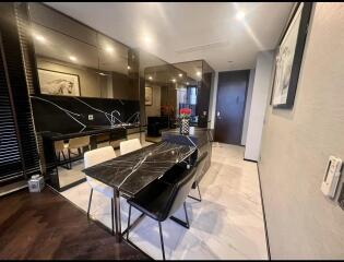 Modern dining area with black marble table and stylish decor