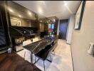 Modern dining area with black marble table and stylish decor