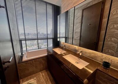 Luxurious bathroom with double sinks and large windows