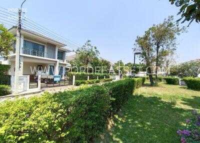 Front view of a residential building with garden