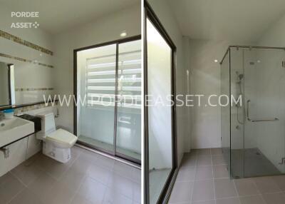 Modern bathroom with toilet and glass shower enclosure