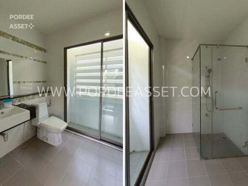 Modern bathroom with toilet and glass shower enclosure