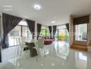 Modern living and dining area with large windows