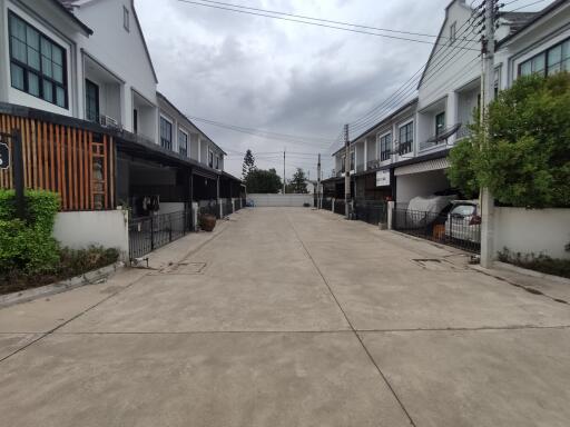 Exterior view of townhouses with driveway