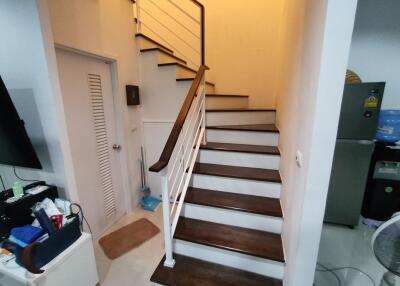 Modern staircase with wooden steps and metal railings