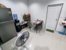 Kitchen area with dining table and appliances