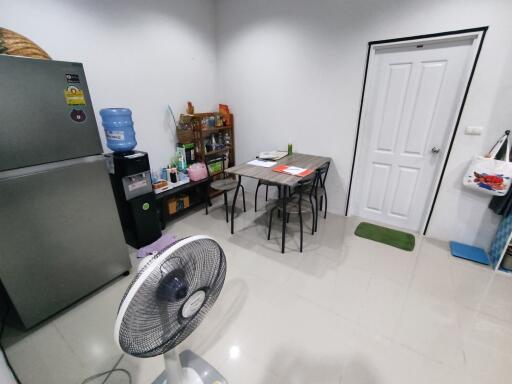 Kitchen area with dining table and appliances