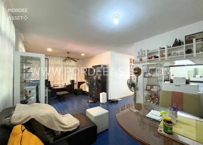 Main living area with blue tiled floor and modern furnishings